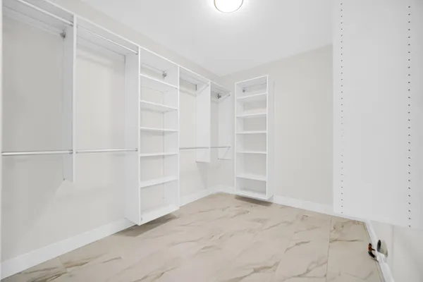a view of an empty walk in closet