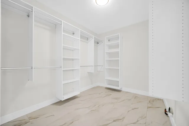 a view of an empty walk in closet