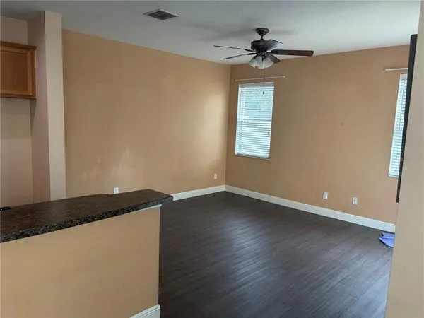 a kitchen with kitchen island a counter top space appliances and cabinets