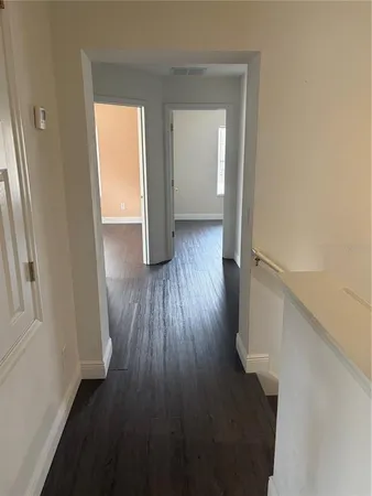 a bathroom with a toilet sink vanity tub and shower