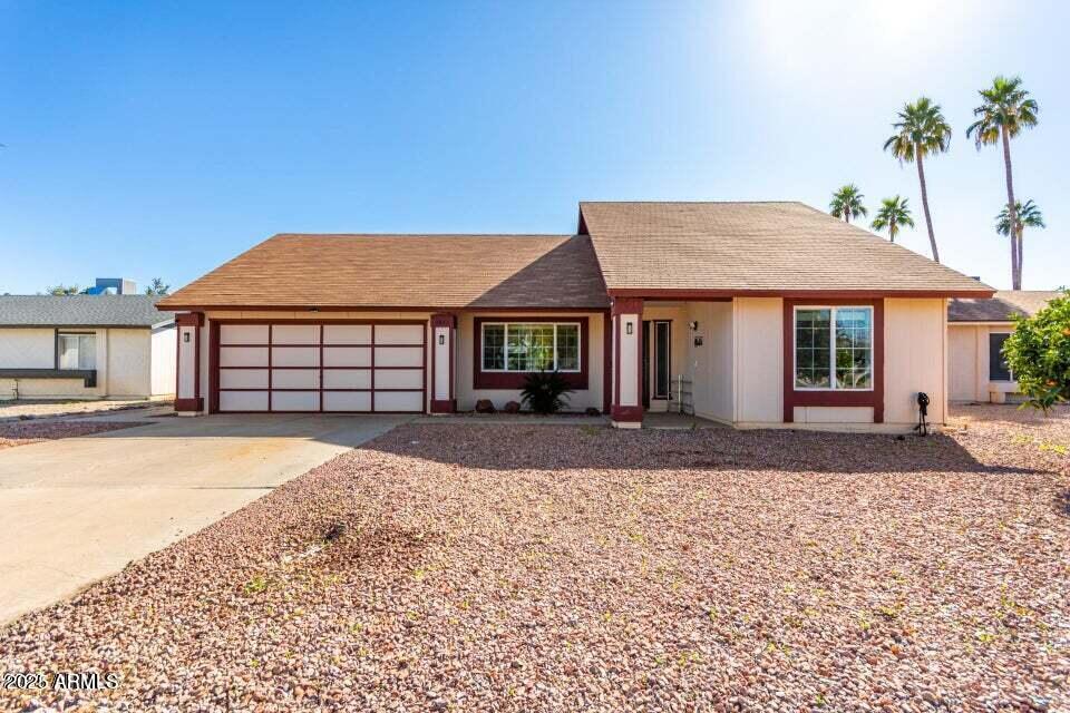 1807 West Mission Drive Chandler, AZ 85224 - Photo 1 of 3 a front view of a house with a yard