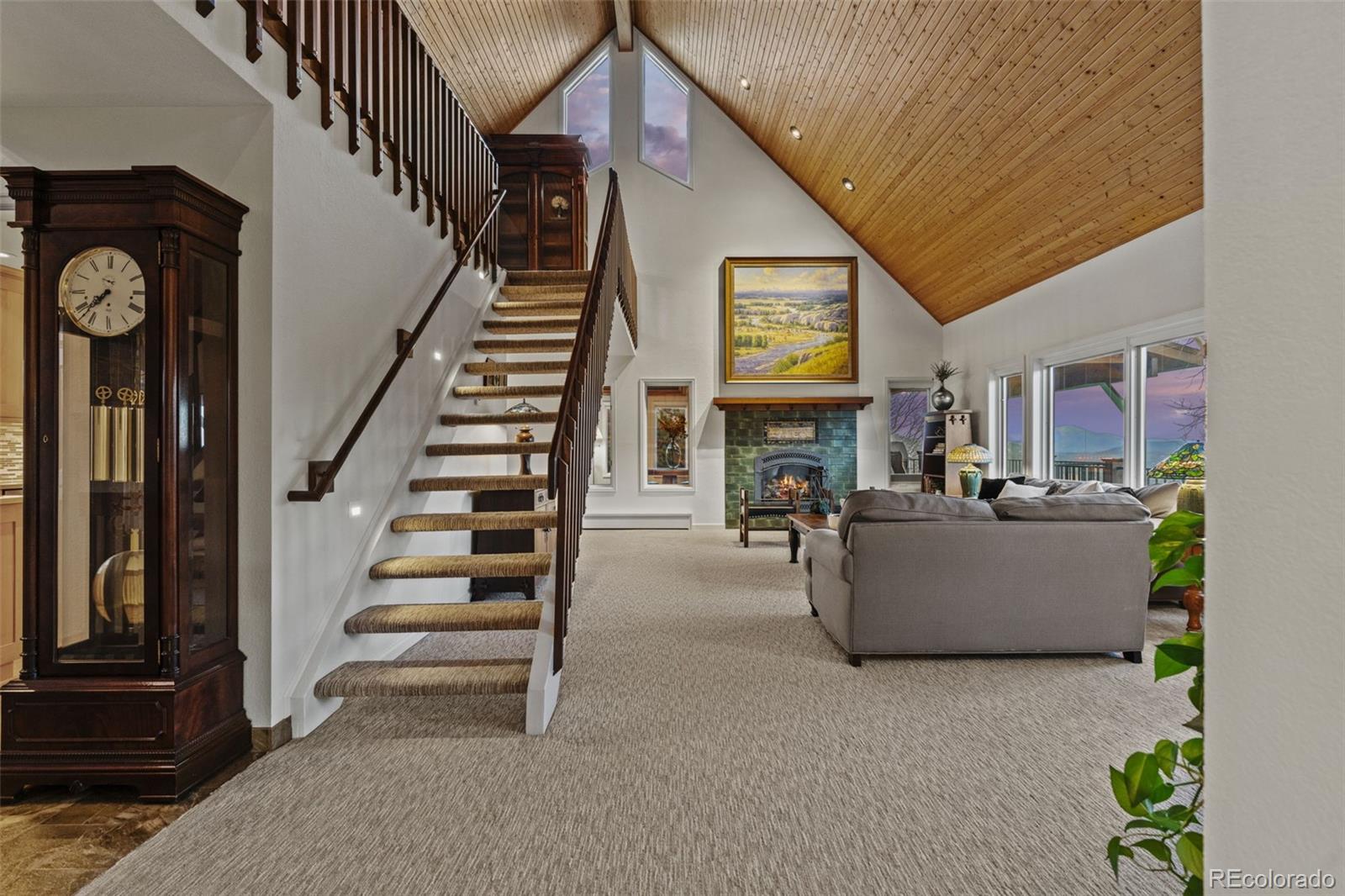 830 Jesse Lane Bailey, CO 80421 - Photo 12 of 45 a living room with furniture and a fireplace