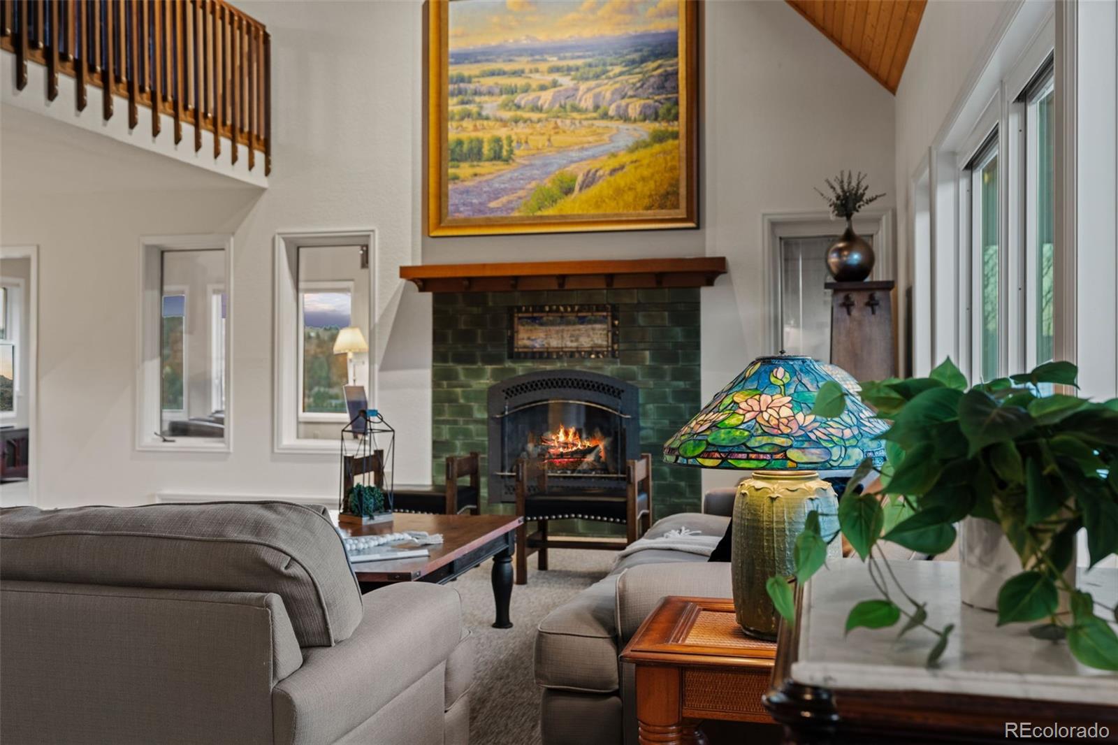 830 Jesse Lane Bailey, CO 80421 - Photo 13 of 45 a living room with furniture and a fireplace