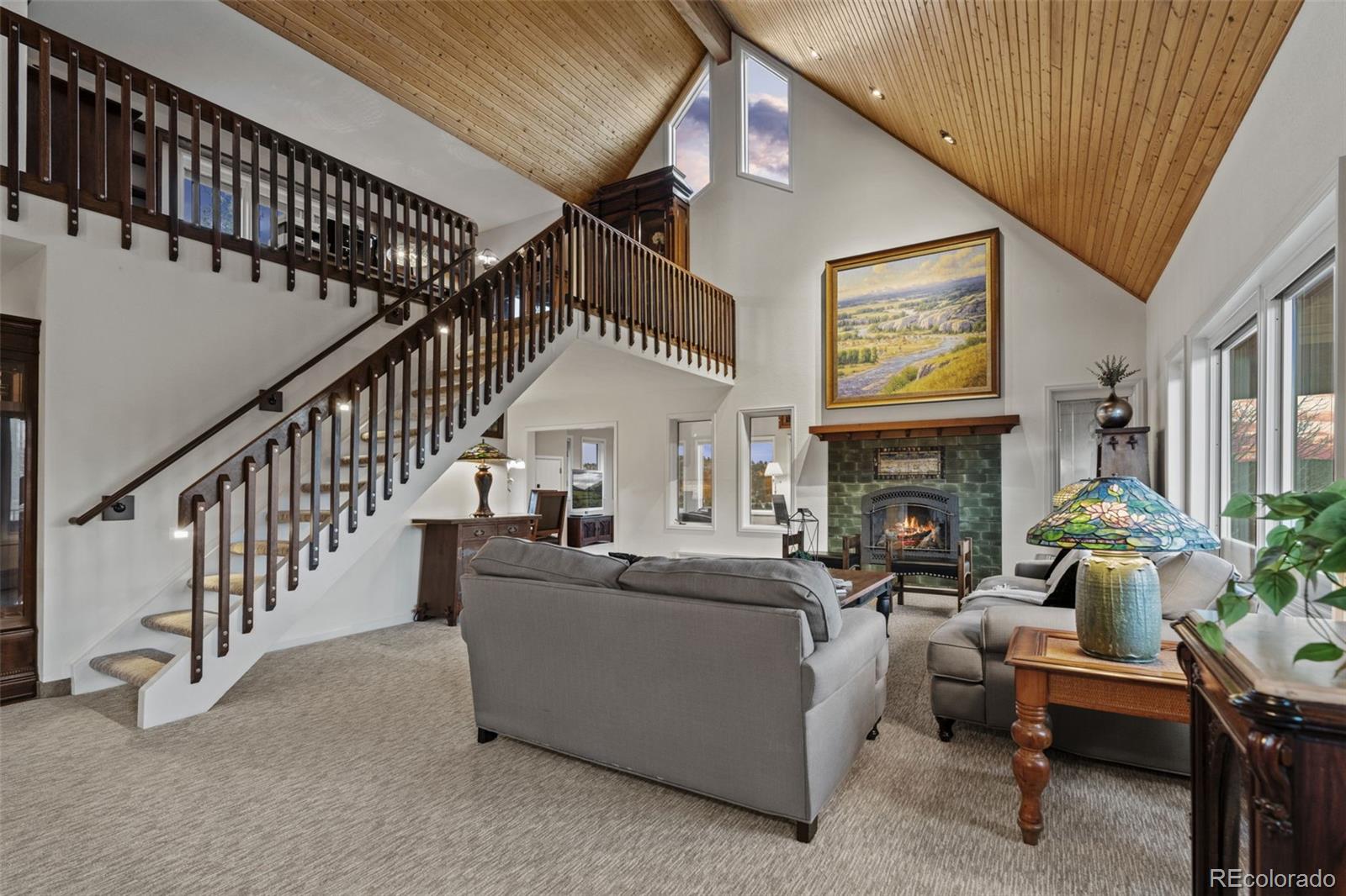 830 Jesse Lane Bailey, CO 80421 - Photo 14 of 45 a living room with furniture and a fireplace