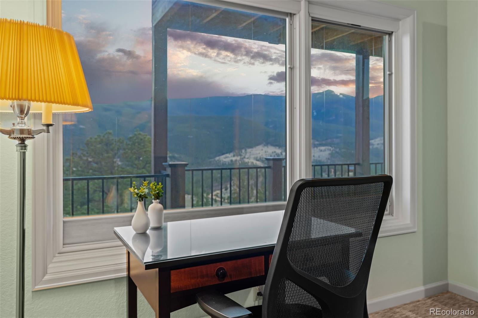 830 Jesse Lane Bailey, CO 80421 - Photo 19 of 45 a view of a chair and table in the balcony