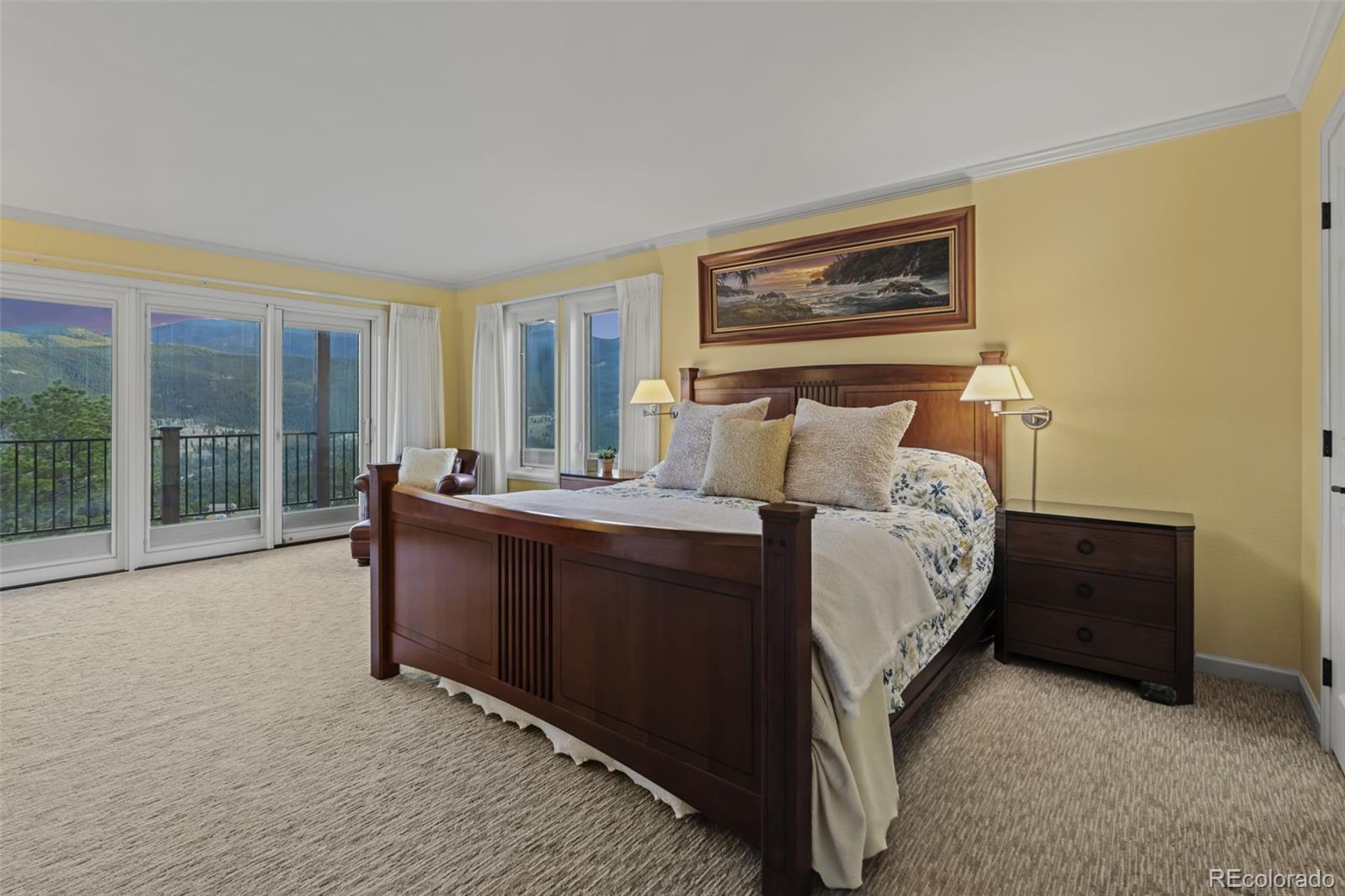 830 Jesse Lane Bailey, CO 80421 - Photo 20 of 45 a bed room with a bed and a large window