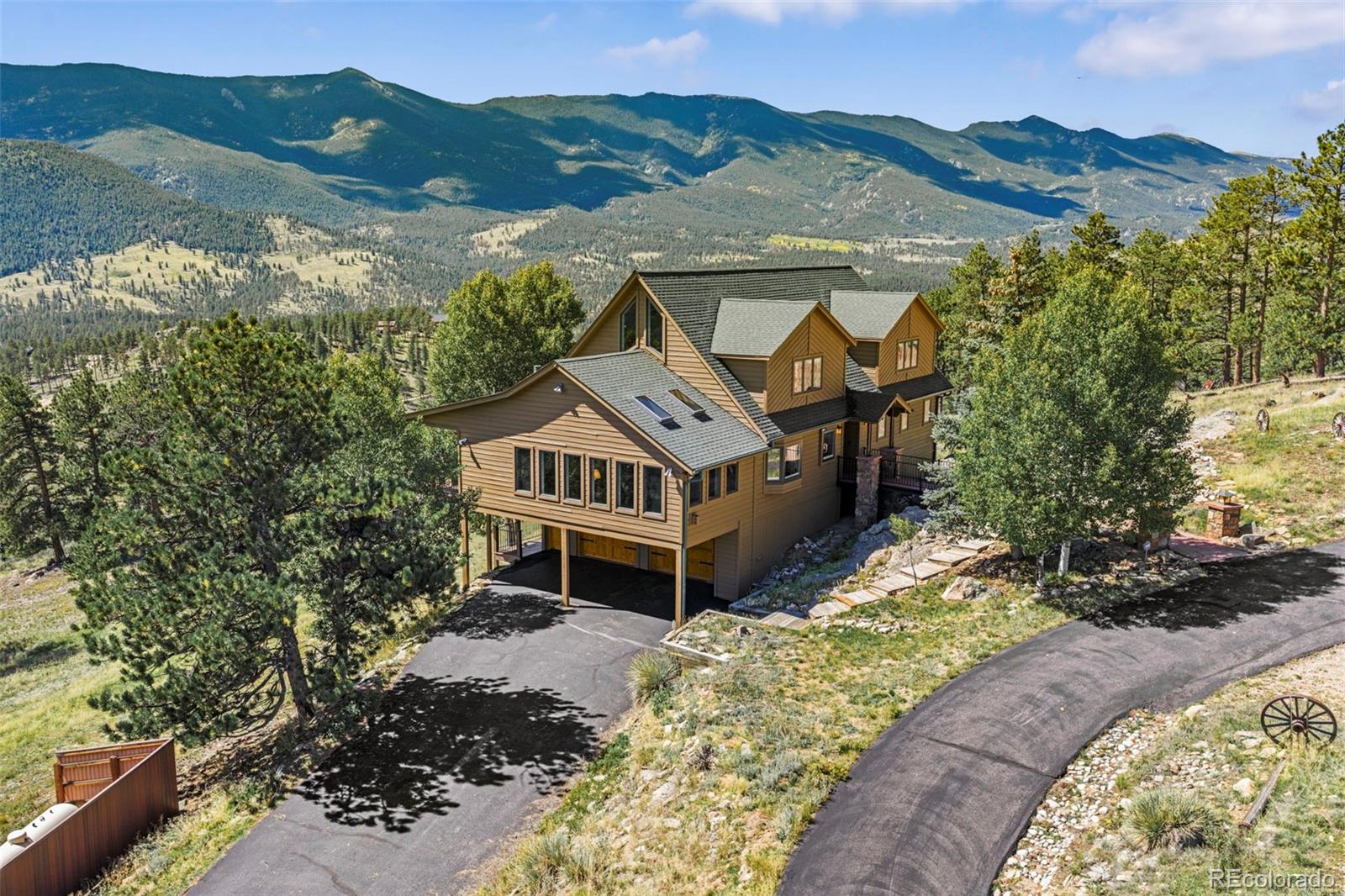 830 Jesse Lane Bailey, CO 80421 - Photo 2 of 45 an aerial view of a house with a garden