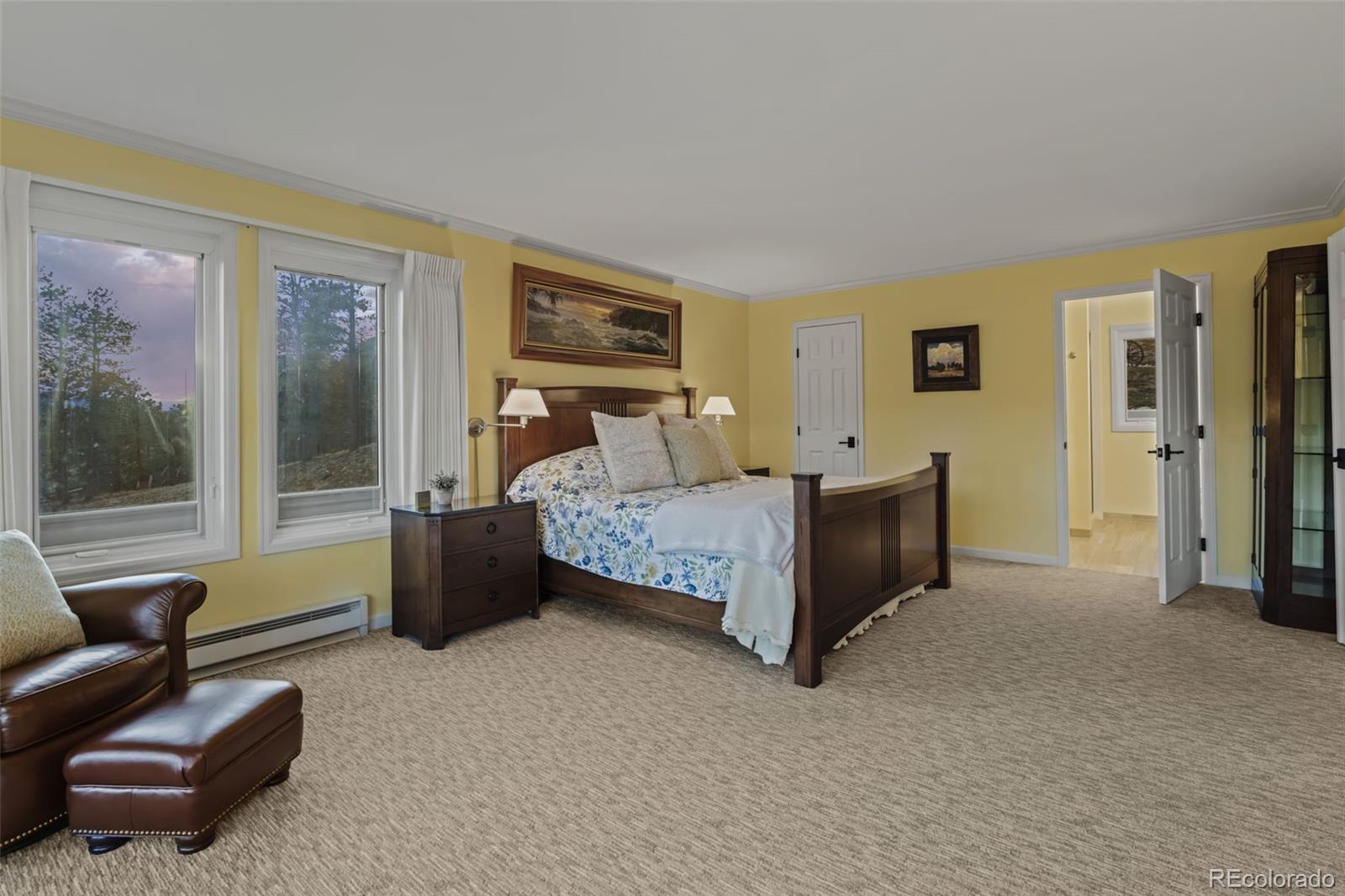 830 Jesse Lane Bailey, CO 80421 - Photo 21 of 45 a bedroom with a bed couch and a window