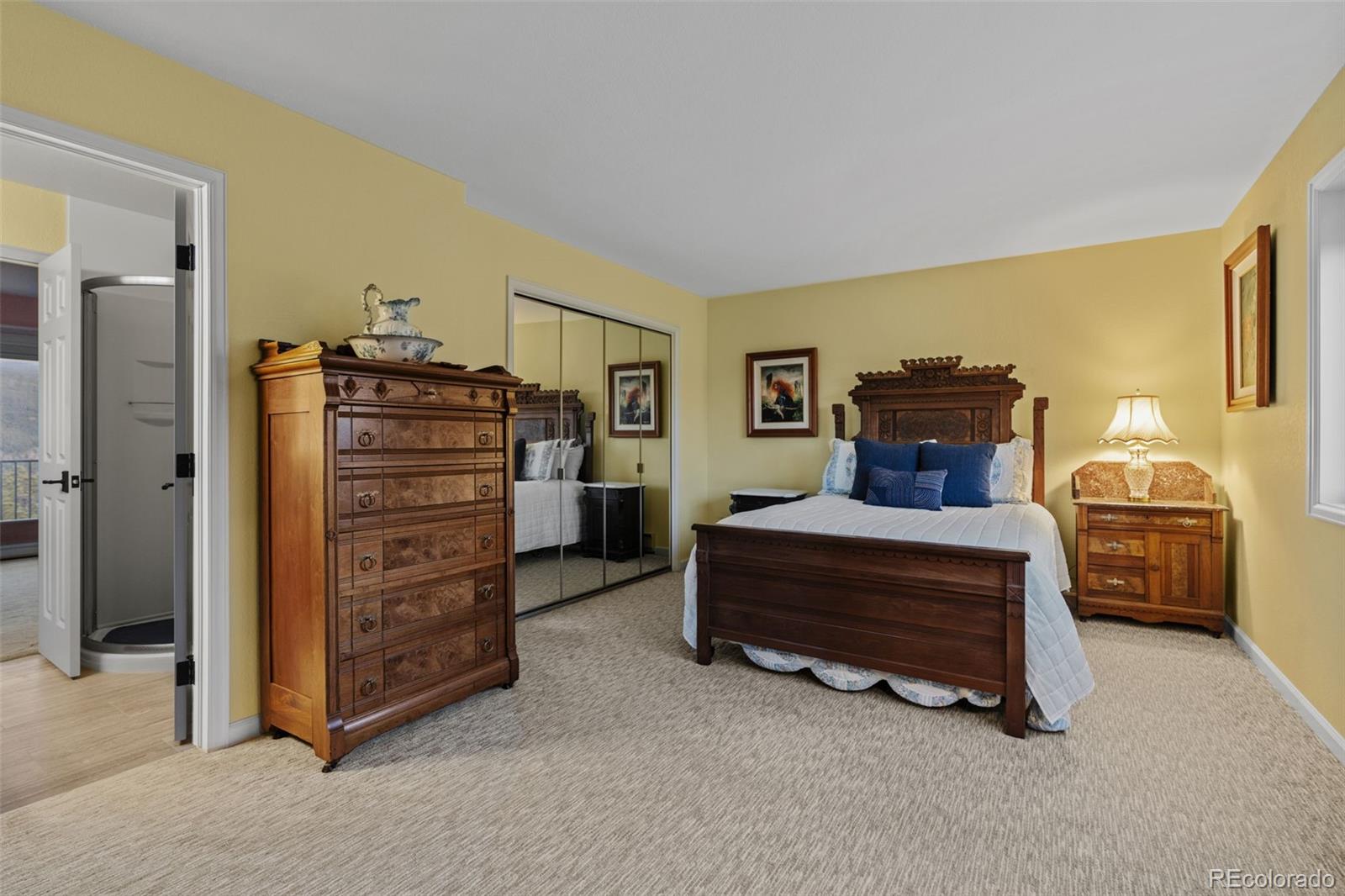 830 Jesse Lane Bailey, CO 80421 - Photo 29 of 45 a bedroom with a bed and a cabinet