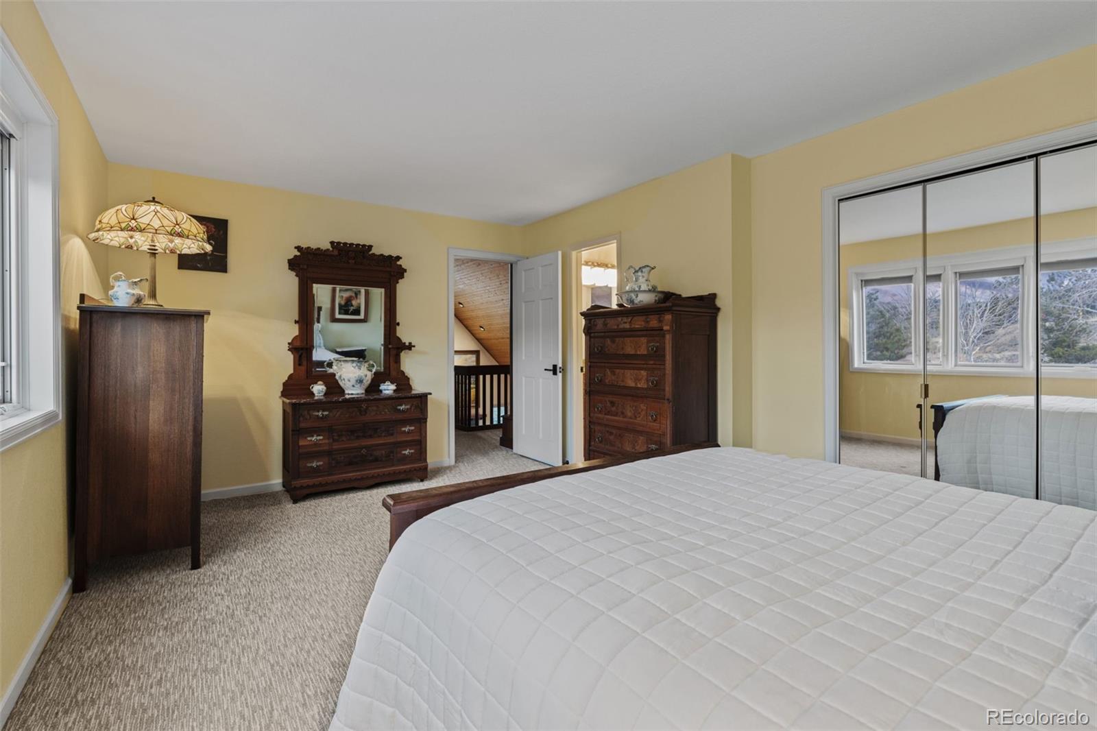 830 Jesse Lane Bailey, CO 80421 - Photo 30 of 45 a bedroom with a bed and dresser