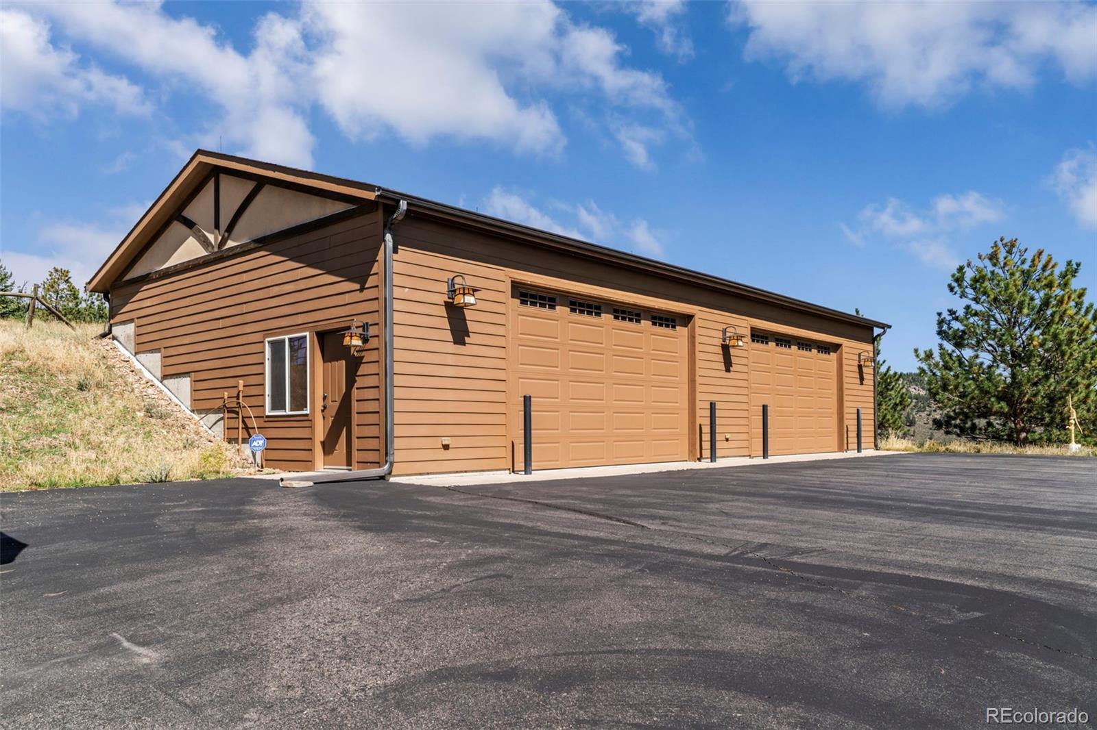 830 Jesse Lane Bailey, CO 80421 - Photo 38 of 45 a view of house with garage and yard