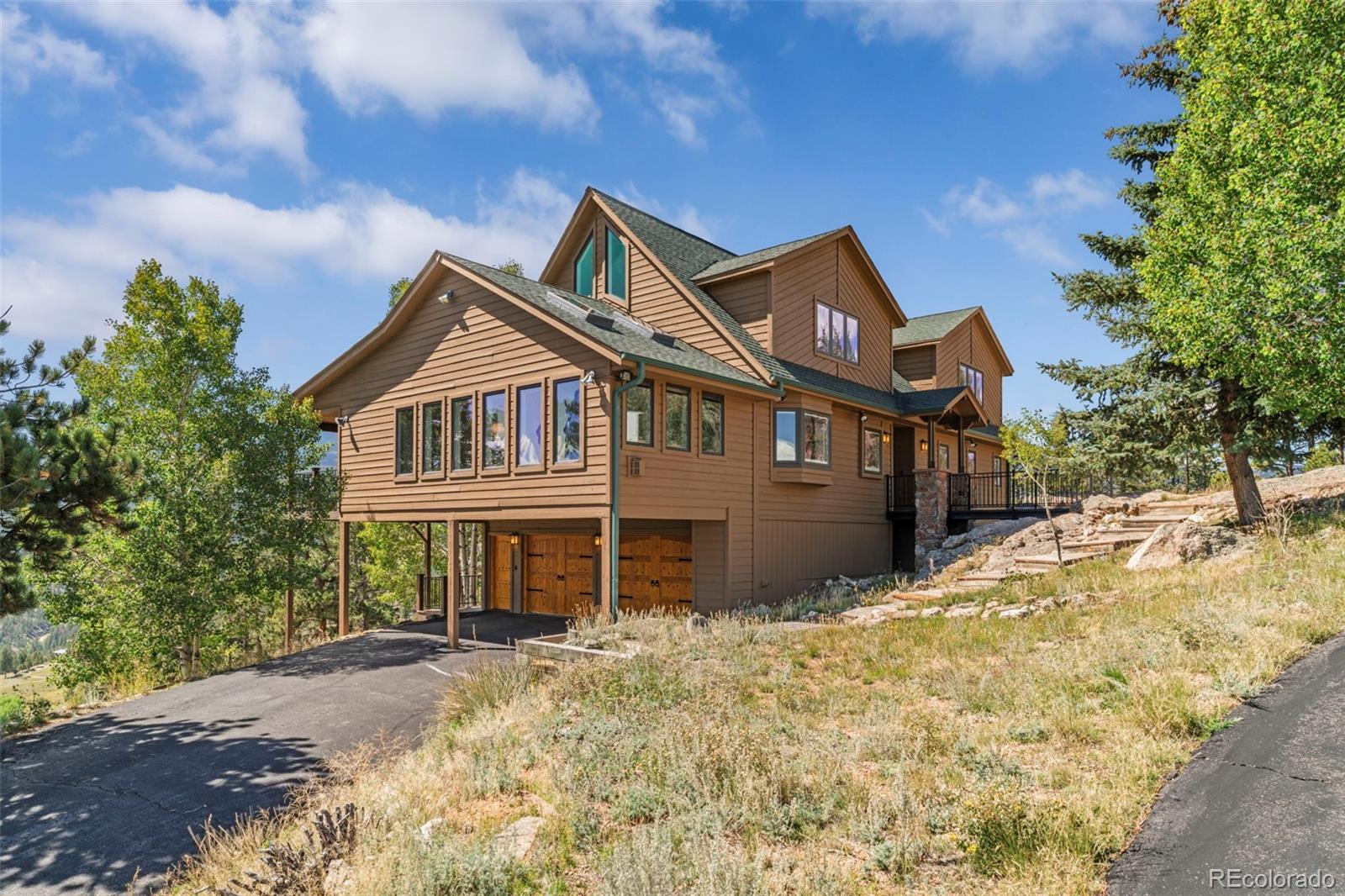 830 Jesse Lane Bailey, CO 80421 - Photo 39 of 45 a front view of a house with a yard