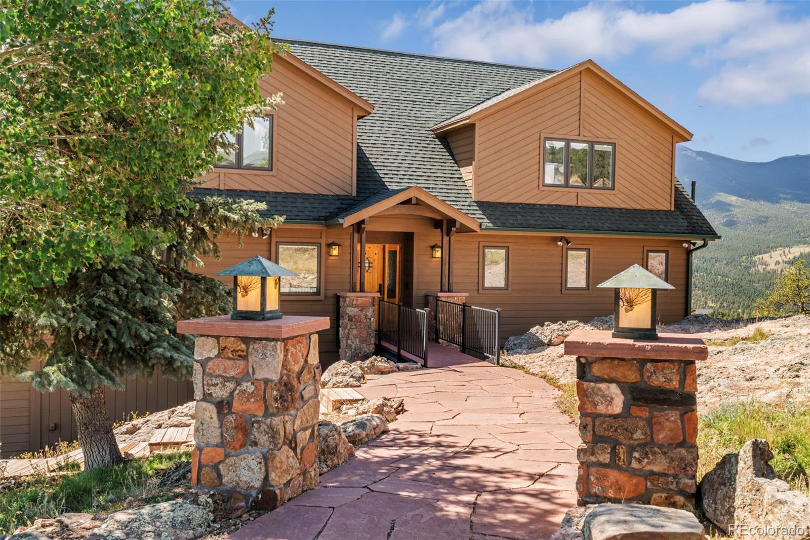 830 Jesse Lane Bailey, CO 80421 - Photo 40 of 45 a front view of a house with a yard outdoor seating and kitchen view