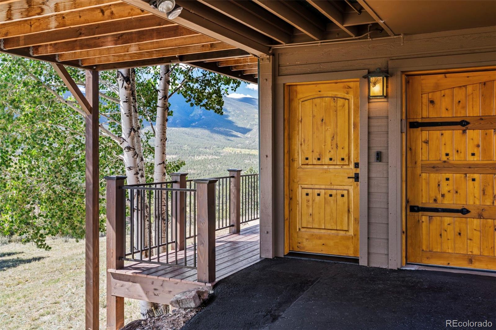 830 Jesse Lane Bailey, CO 80421 - Photo 41 of 45 a view of porch with a door and wooden floor