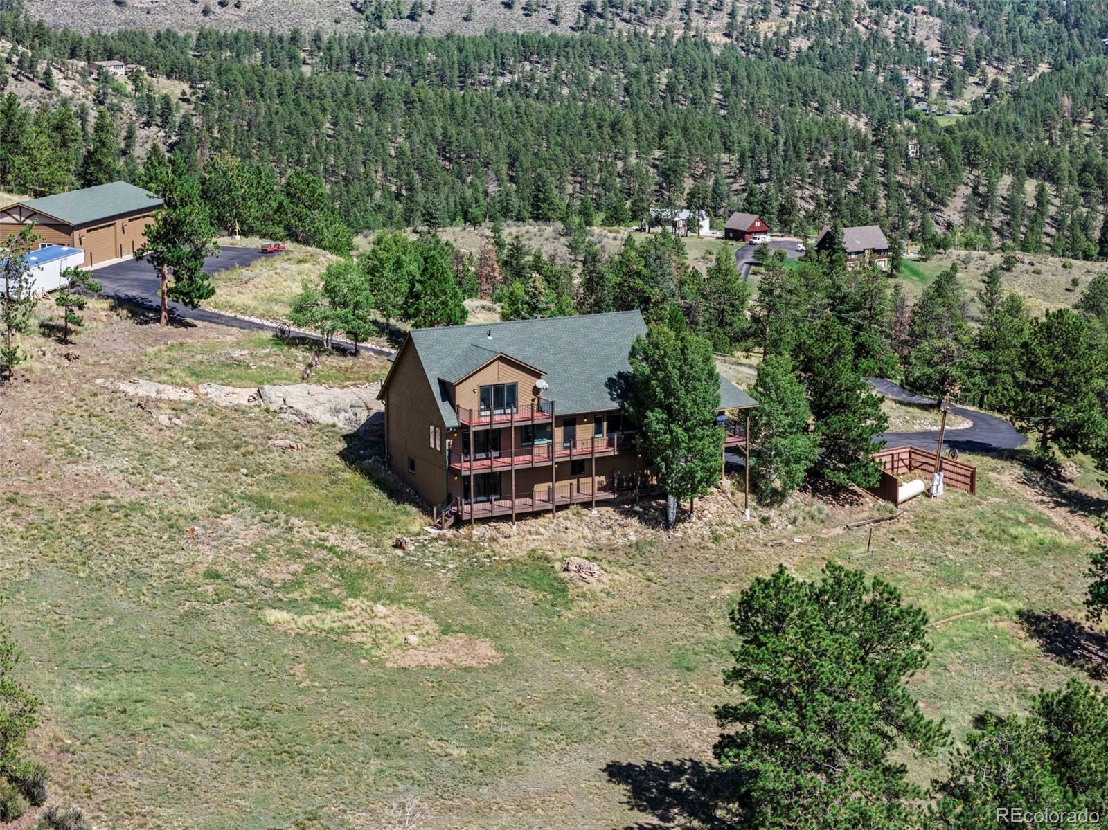 830 Jesse Lane Bailey, CO 80421 - Photo 5 of 45 an aerial view of a house with a yard