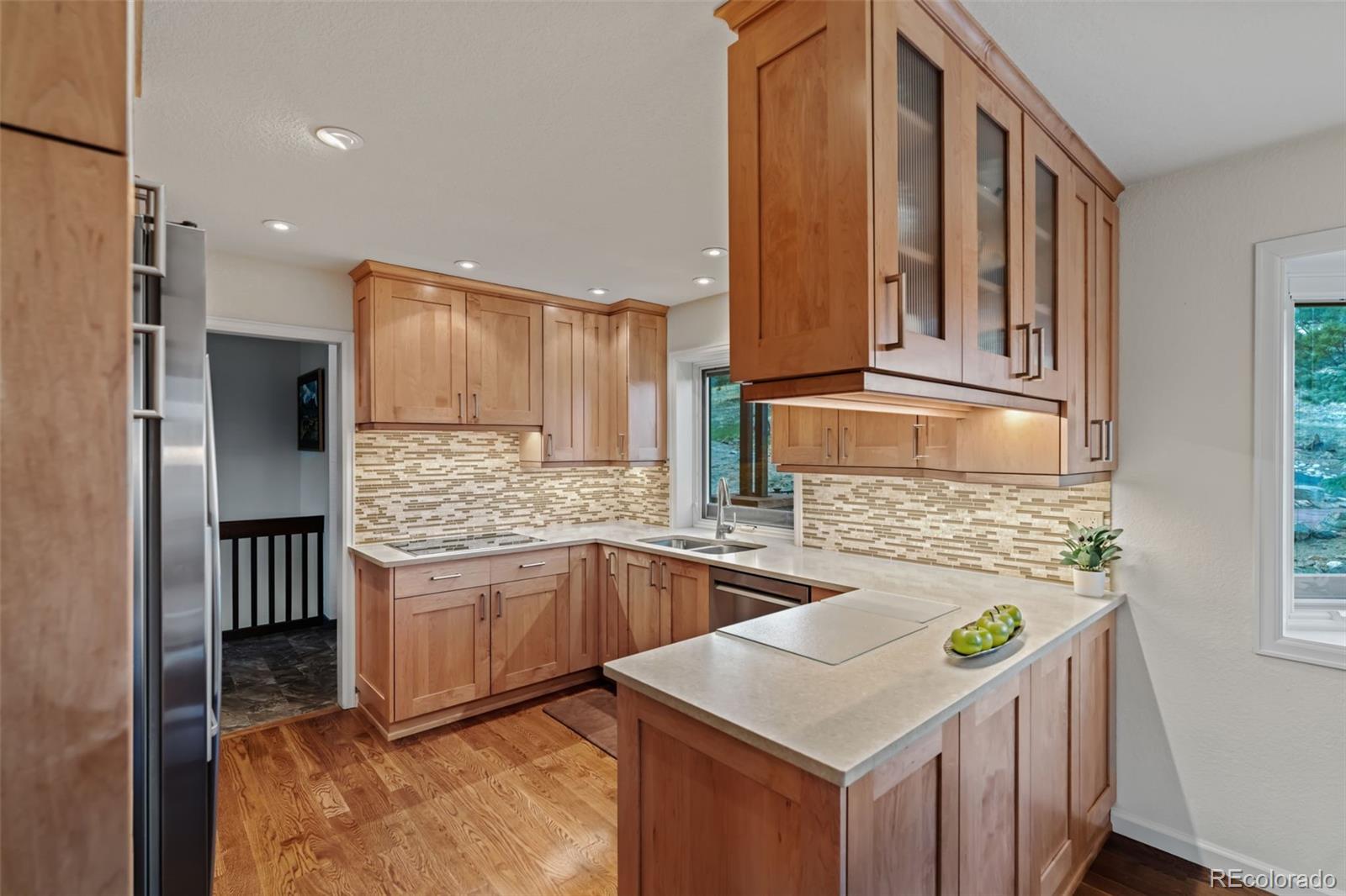 830 Jesse Lane Bailey, CO 80421 - Photo 7 of 45 a kitchen with stainless steel appliances granite countertop a sink and a refrigerator