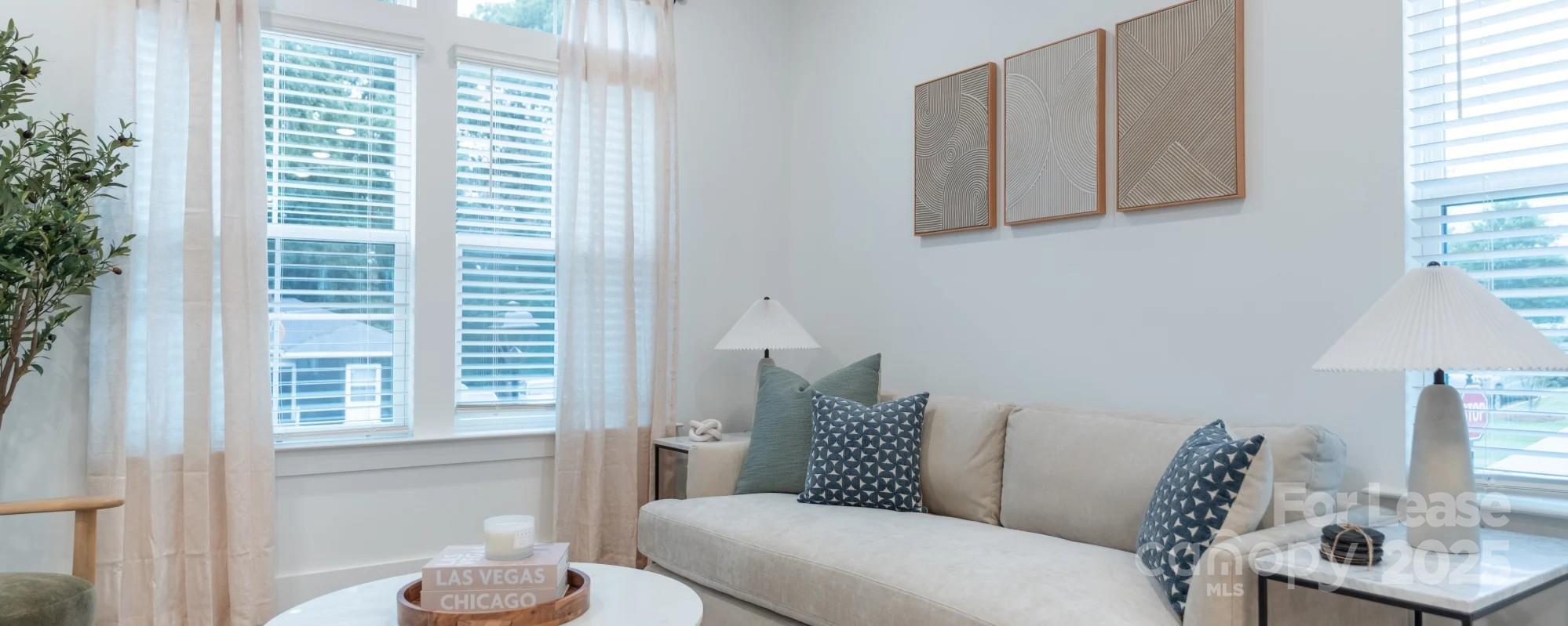2741 Rozzelles Ferry Road Charlotte, NC 28208 - Photo 12 of 25 a living room with furniture and a window