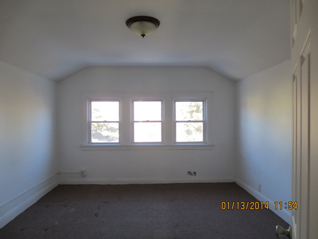 114 West Roosevelt Road Wheaton, IL 60187 - Photo 13 of 16 an empty room with a window