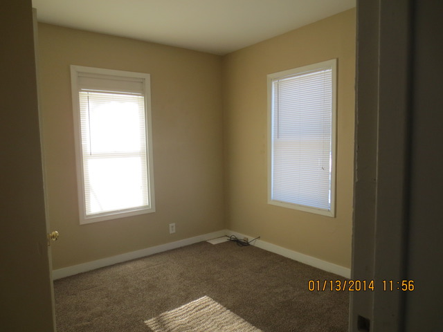 114 West Roosevelt Road Wheaton, IL 60187 - Photo 15 of 16 a room that has a window in it
