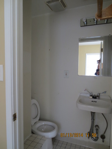 114 West Roosevelt Road Wheaton, IL 60187 - Photo 16 of 16 a bathroom with a toilet sink and mirror
