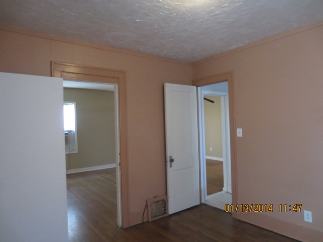 114 West Roosevelt Road Wheaton, IL 60187 - Photo 5 of 16 an empty room with wooden floor & closet area