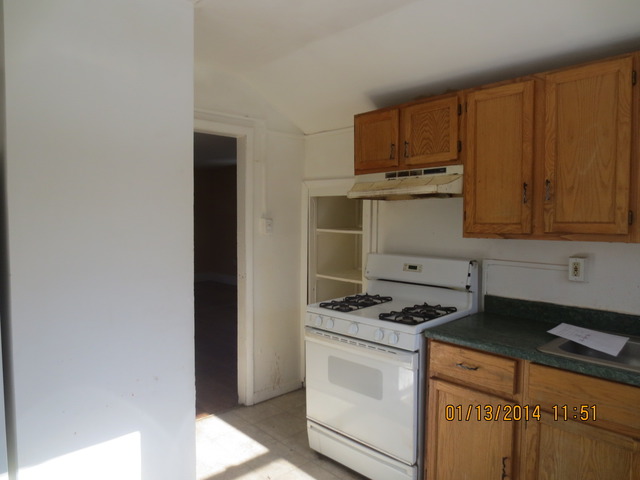 114 West Roosevelt Road Wheaton, IL 60187 - Photo 10 of 16 a kitchen with granite countertop cabinets appliances and a sink