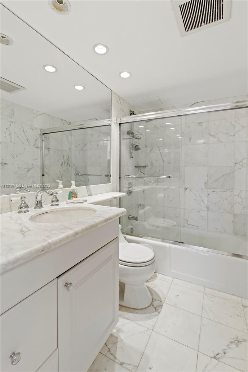 151 Crandon Boulevard, Unit 340 Key Biscayne, FL 33149 - Photo 11 of 26 a bathroom with a sink a toilet and shower