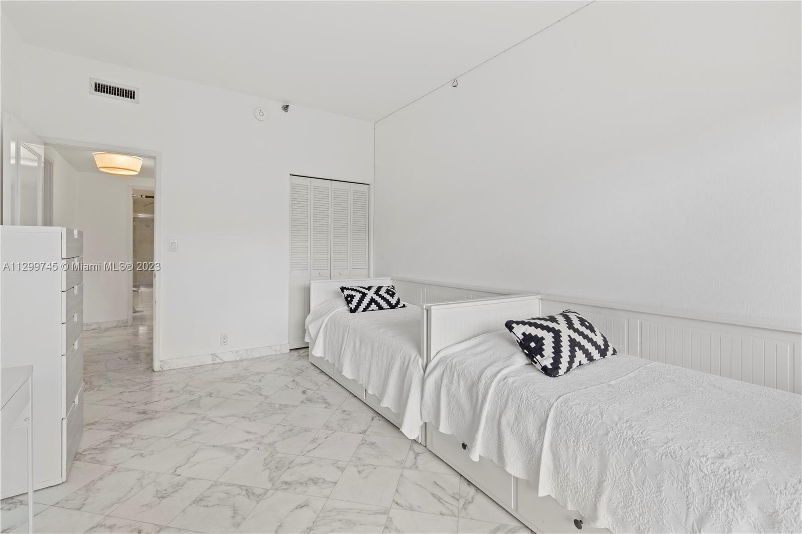 151 Crandon Boulevard, Unit 340 Key Biscayne, FL 33149 - Photo 13 of 26 a view of a bedroom with a bed