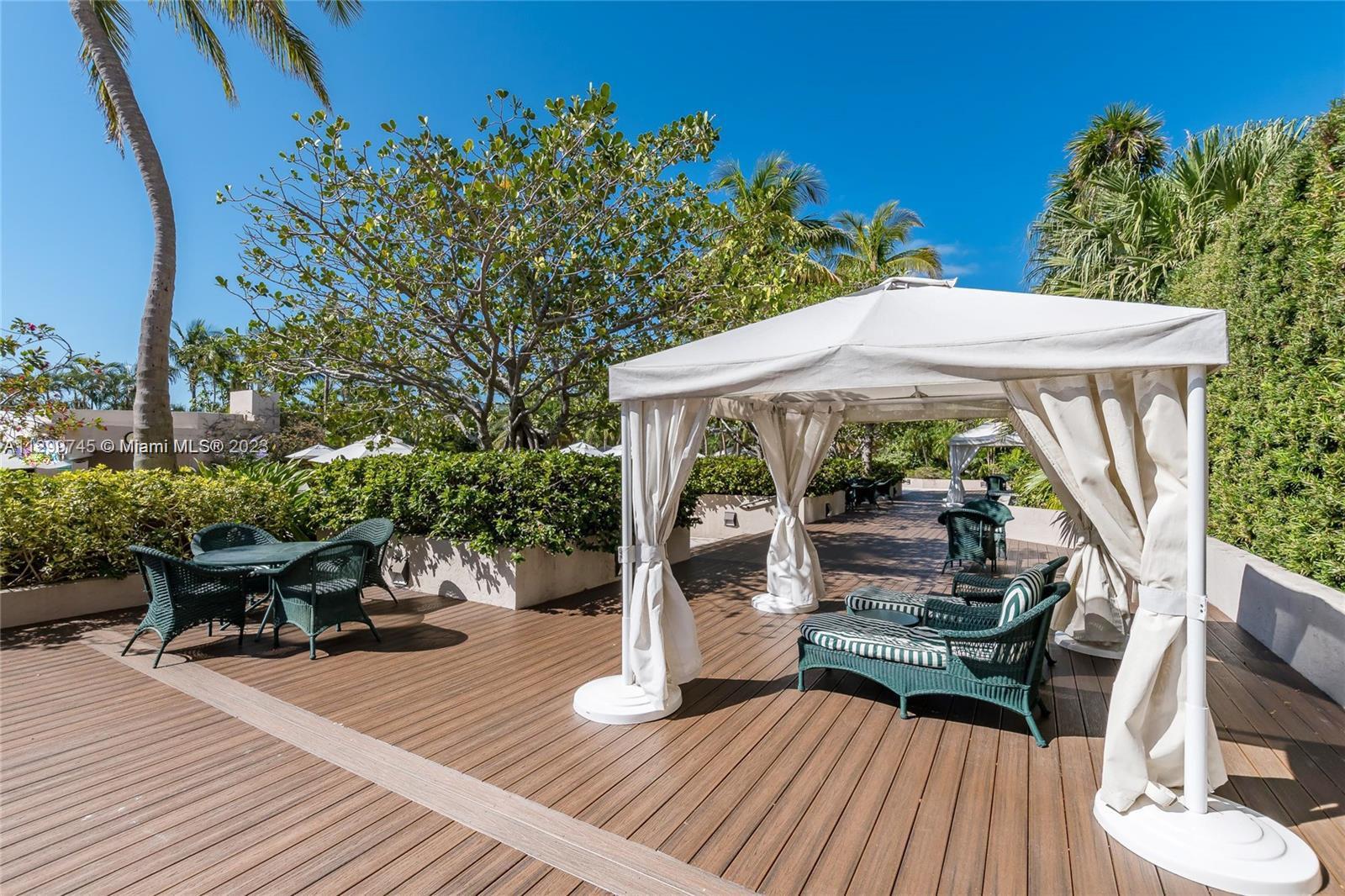 151 Crandon Boulevard, Unit 340 Key Biscayne, FL 33149 - Photo 21 of 26 swimming pool view with a seating space