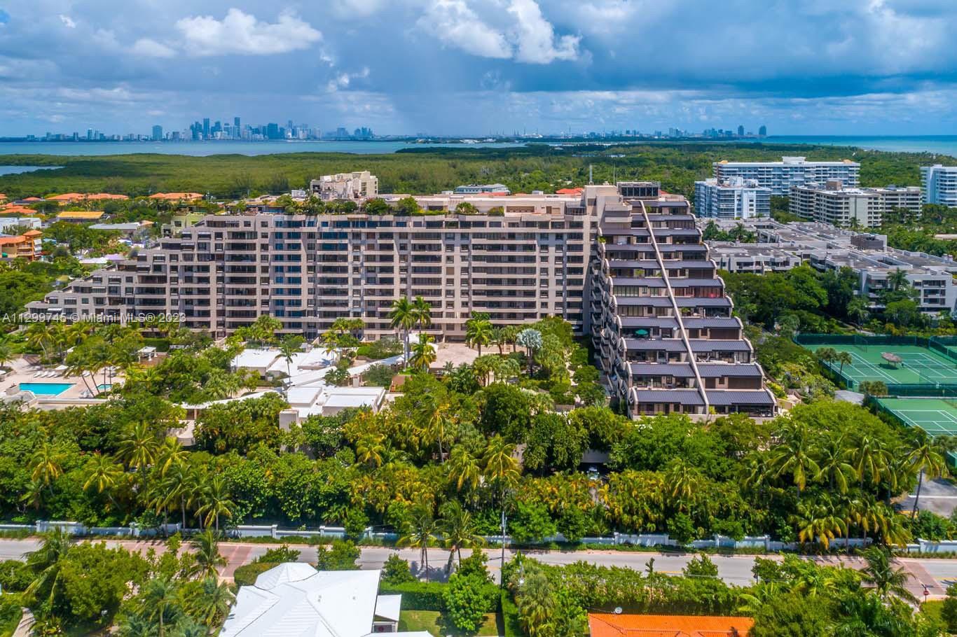 151 Crandon Boulevard, Unit 340 Key Biscayne, FL 33149 - Photo 24 of 26 a view of a lake with a building in the background