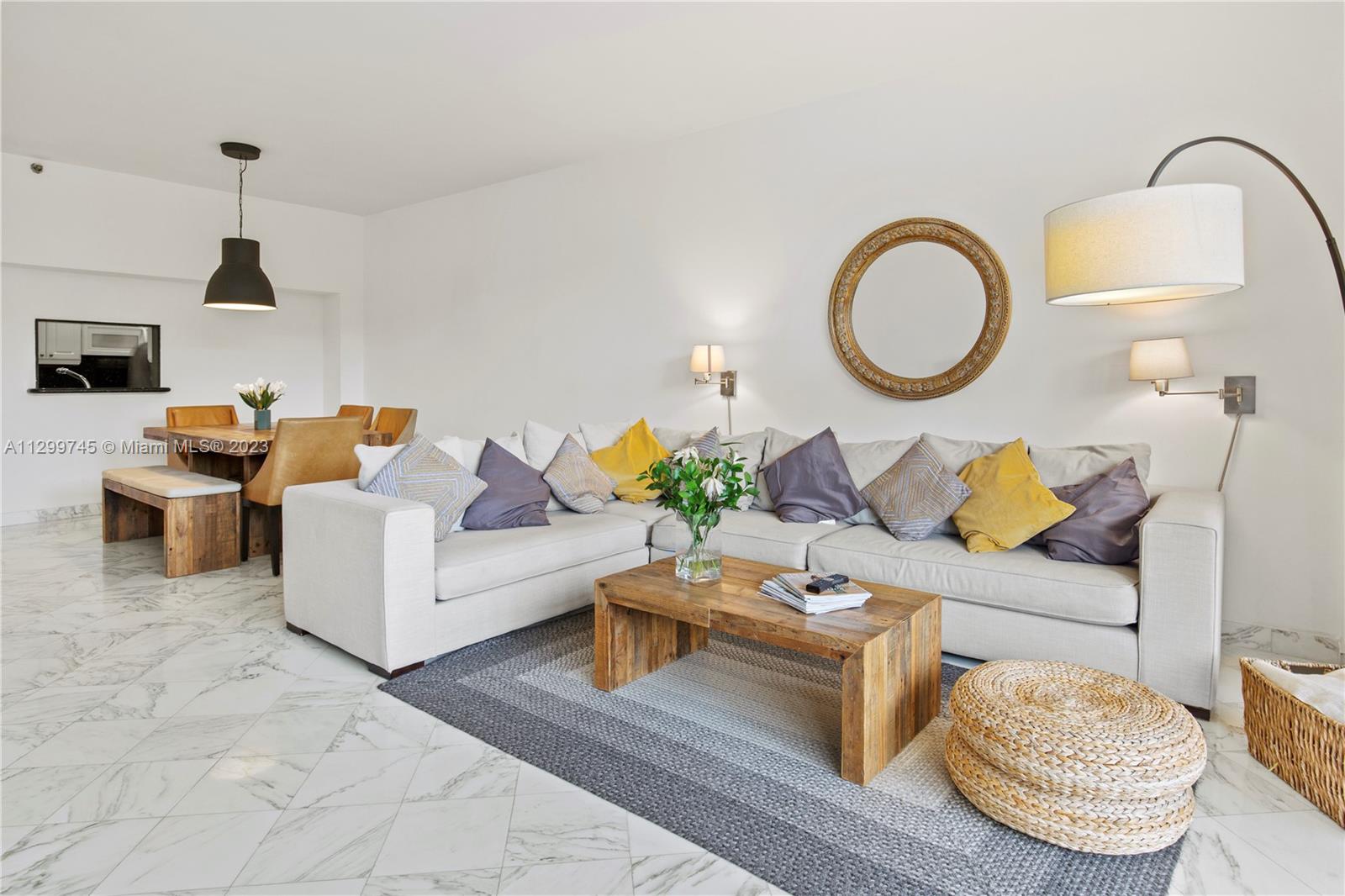 151 Crandon Boulevard, Unit 340 Key Biscayne, FL 33149 - Photo 4 of 26 a living room with furniture and a fireplace