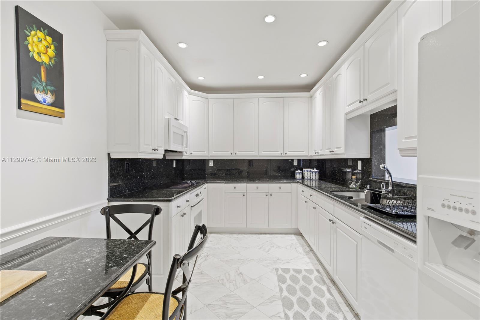 151 Crandon Boulevard, Unit 340 Key Biscayne, FL 33149 - Photo 7 of 26 a kitchen with a sink a stove cabinets and counter space