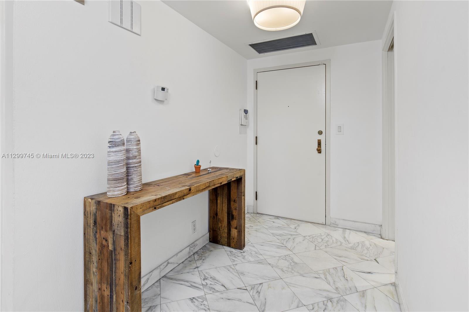 151 Crandon Boulevard, Unit 340 Key Biscayne, FL 33149 - Photo 10 of 26 a view of storage and utility room with washer and dryer