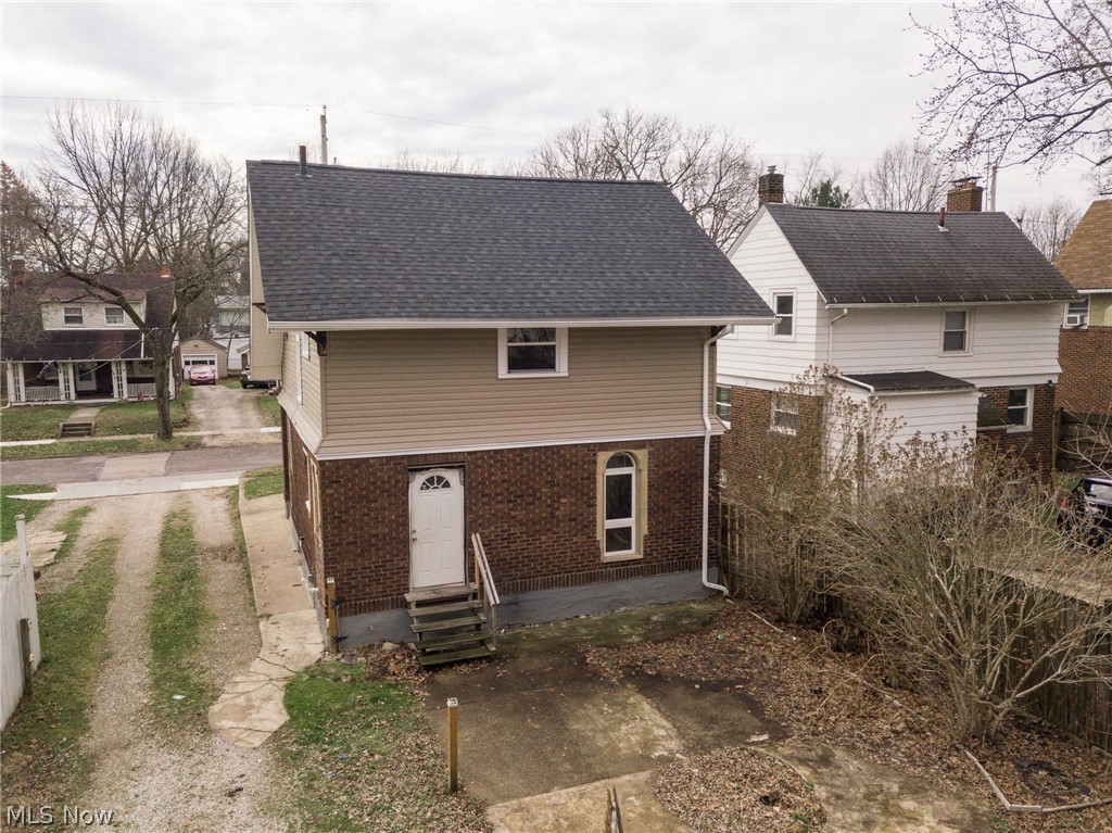 1603 Hampton Road Akron, OH 44305 - Photo 37 of 50 Back of property featuring brick siding and roof with shingles