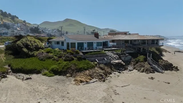 an aerial view of residential house with beach and ocean view