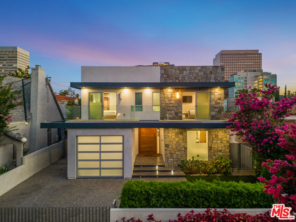 6410 Lindenhurst Avenue Los Angeles, CA 90048 - Photo 2 of 39 a front view of a house with a yard