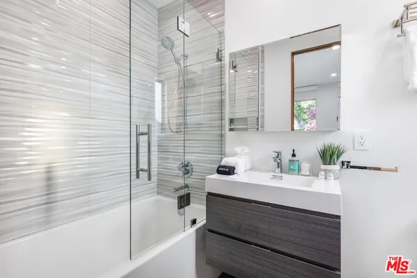 a bathroom with a sink and a bathtub