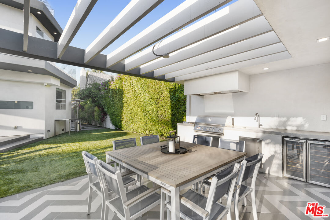 6410 Lindenhurst Avenue Los Angeles, CA 90048 - Photo 33 of 39 a view of a dining room with furniture window and outside view