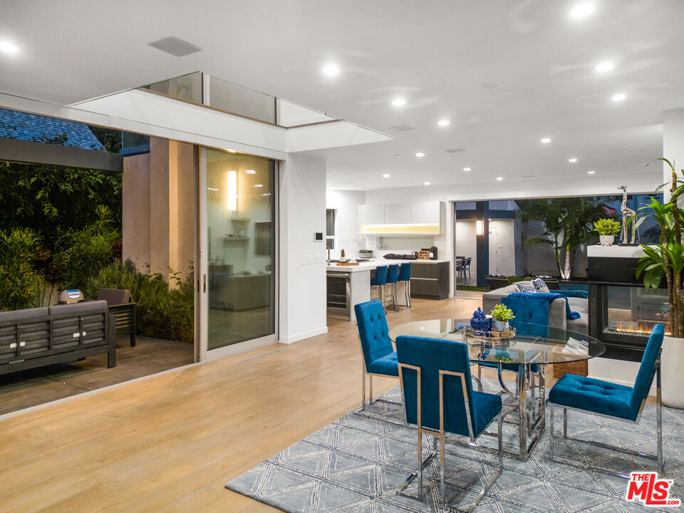 6410 Lindenhurst Avenue Los Angeles, CA 90048 - Photo 38 of 39 a view of a dining room with furniture