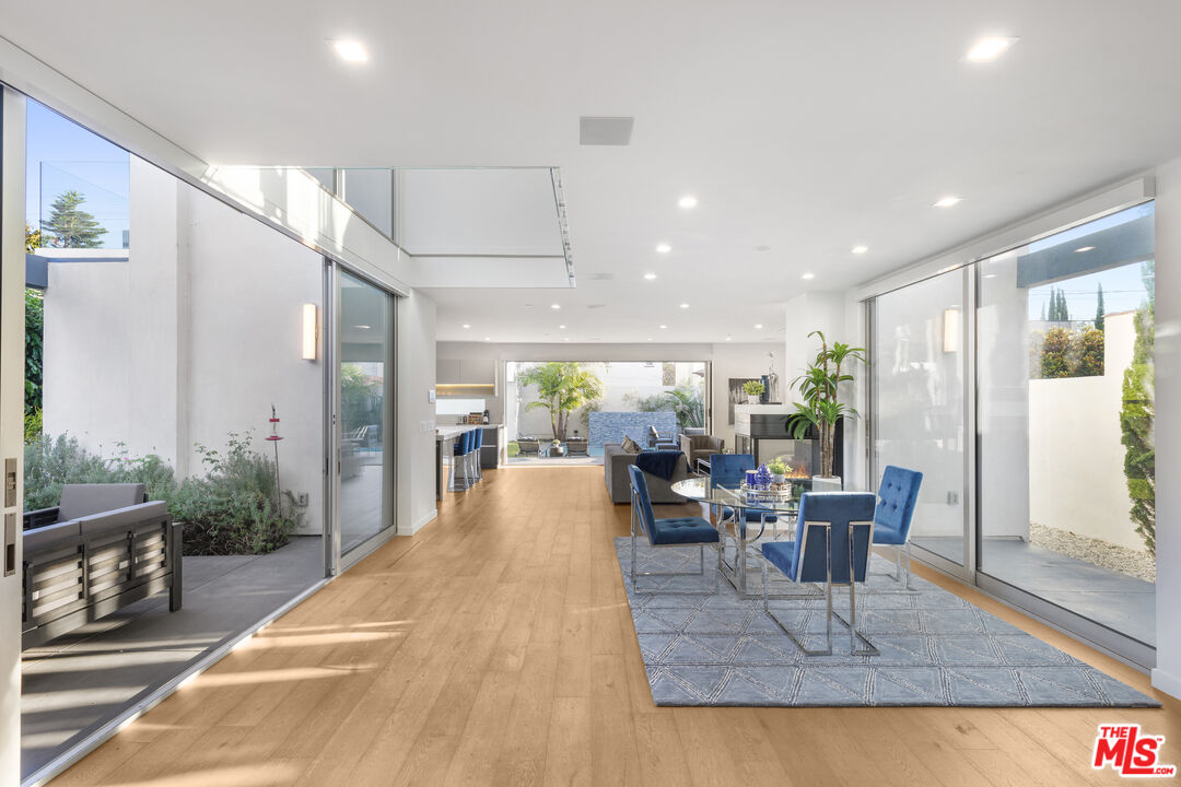 6410 Lindenhurst Avenue Los Angeles, CA 90048 - Photo 7 of 39 a view of a dining room with furniture window and outside view