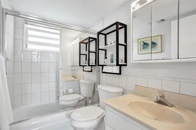 a bedroom with a bed and a table