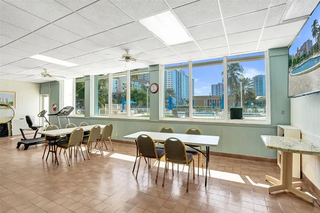 a view of a building with table and chairs