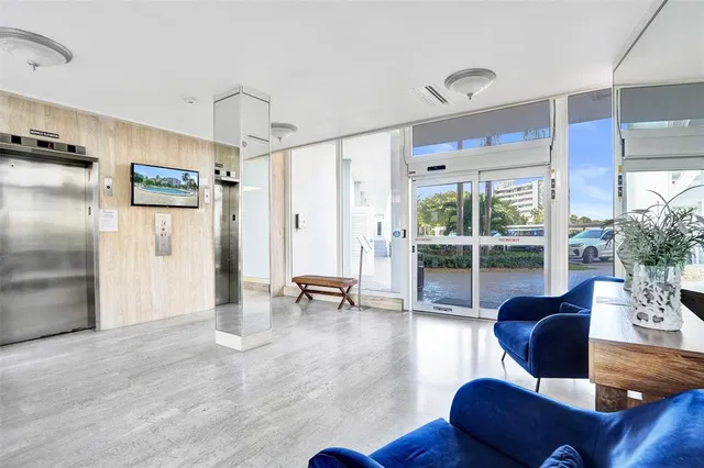 a view of a patio with swimming pool and outdoor seating