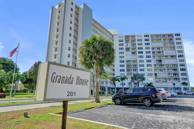 a view of a city with lawn chairs