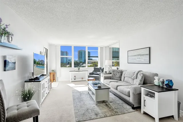 a living room with a couch and a window