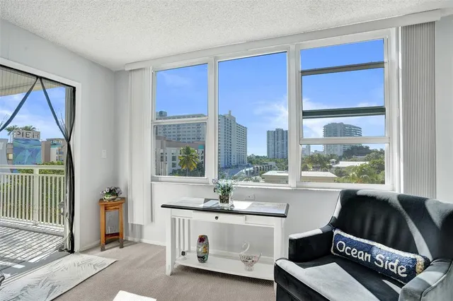 a view of balcony with wooden floor