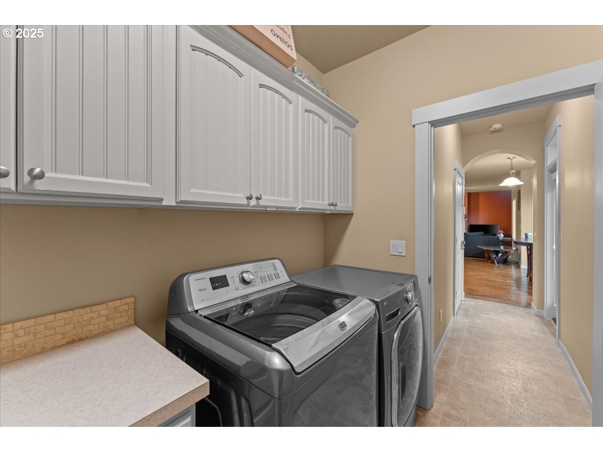 15485 Southwest Willamette Valley Court Beaverton, OR 97007 - Photo 20 of 48 a kitchen with a stove and a white cabinets