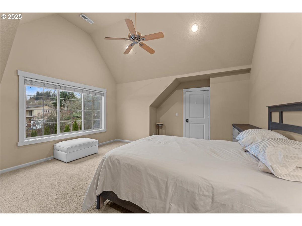 15485 Southwest Willamette Valley Court Beaverton, OR 97007 - Photo 29 of 48 a bedroom with a bed and window