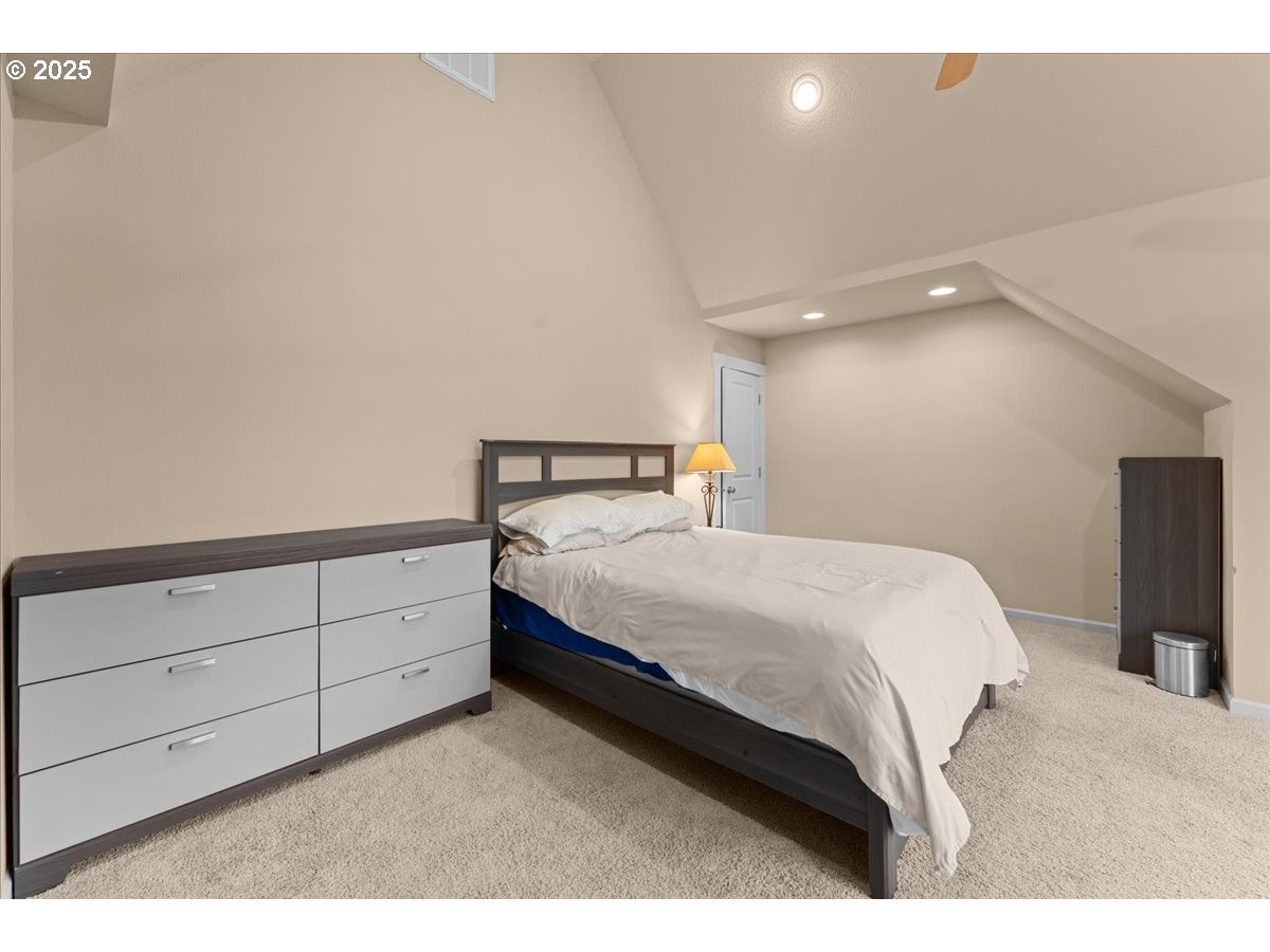 15485 Southwest Willamette Valley Court Beaverton, OR 97007 - Photo 31 of 48 a bedroom with a bed and cabinet
