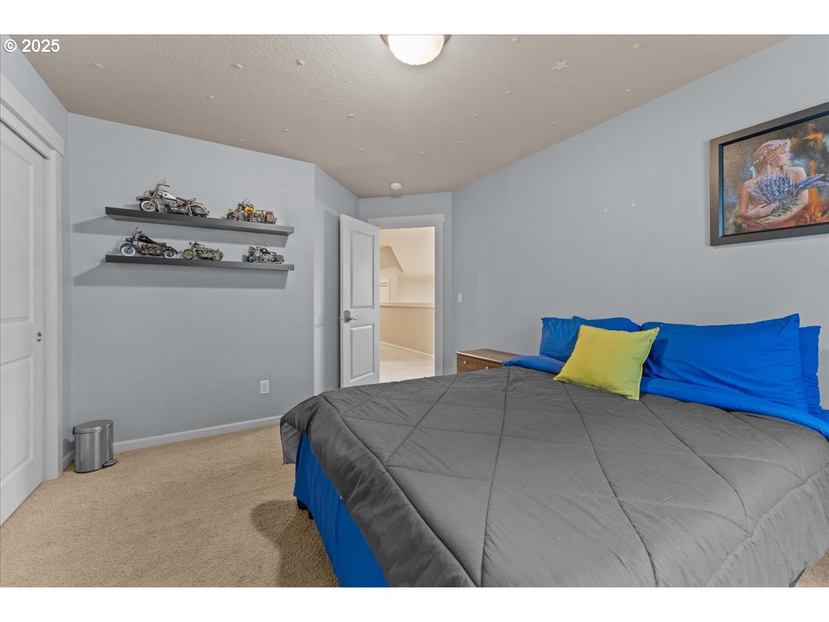 15485 Southwest Willamette Valley Court Beaverton, OR 97007 - Photo 37 of 48 a bedroom with a bed and a window